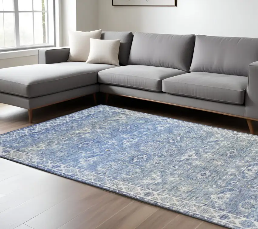 Blue And Ivory Oriental Distressed Area Rug Photo 1