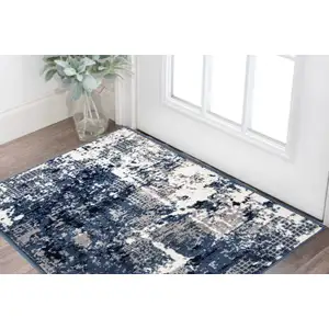 Photo of Blue And Ivory Abstract Area Rug
