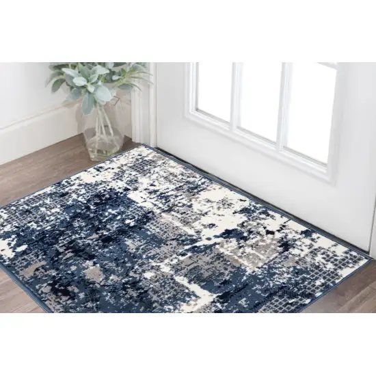 Blue And Ivory Abstract Area Rug Photo 1