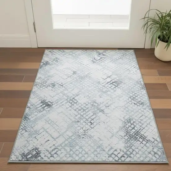 Blue And Ivory Abstract Geometric Washable Area Rug With UV Protection Photo 2
