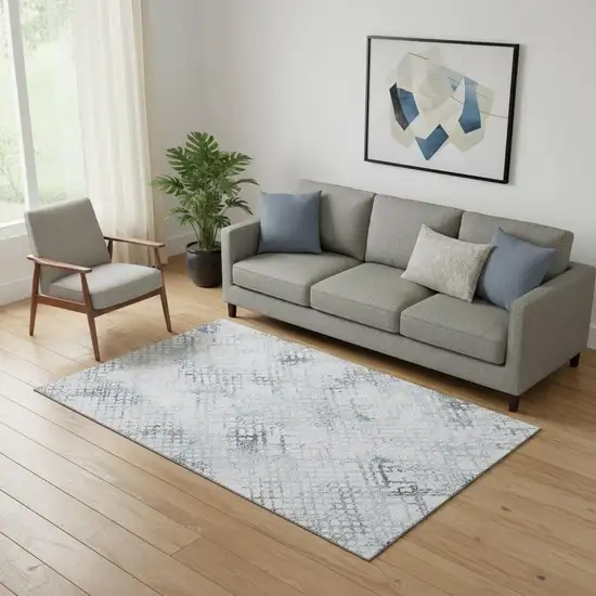 Blue And Ivory Abstract Geometric Washable Area Rug With UV Protection Photo 1