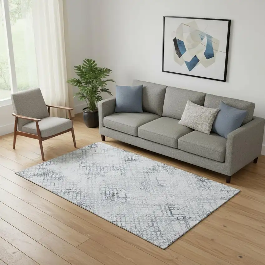 Blue And Ivory Abstract Geometric Washable Area Rug With UV Protection Photo 1