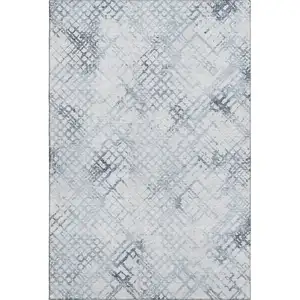 Photo of Blue And Ivory Abstract Geometric Washable Area Rug With UV Protection