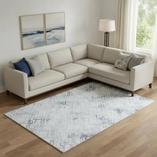 Blue And Ivory Abstract Geometric Washable Area Rug With UV Protection Photo 1