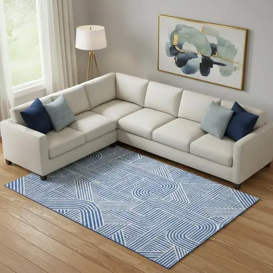 Blue And Ivory Abstract Geometric Washable Area Rug With UV Protection Photo 1