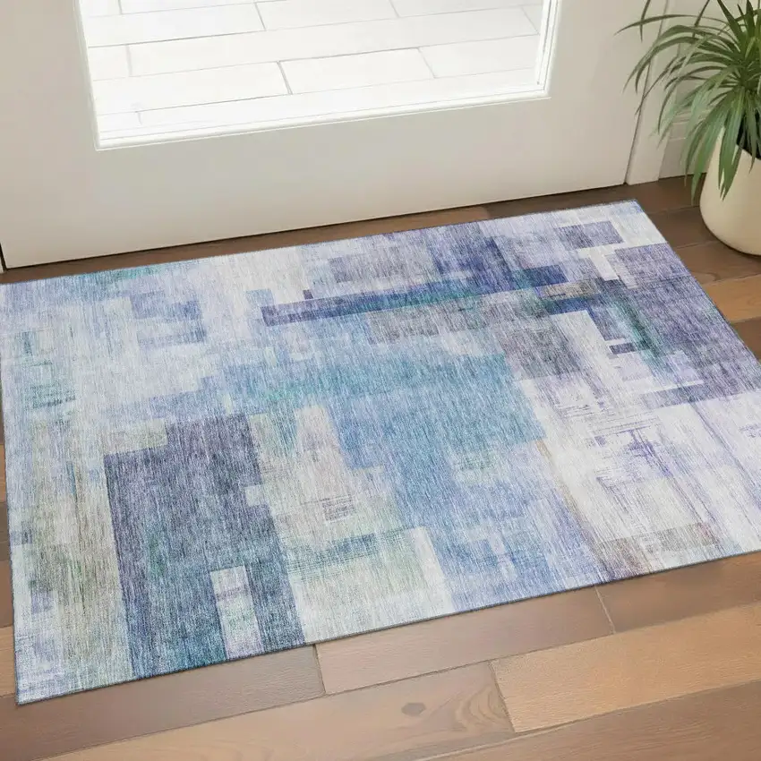 Blue And Ivory Abstract Geometric Washable Area Rug With UV Protection Photo 1