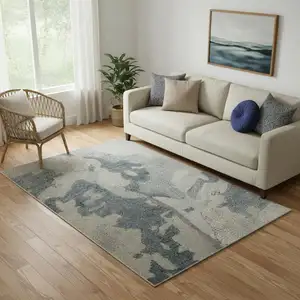 Photo of Blue And Ivory Abstract Hand Tufted Area Rug