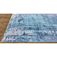 Photo of Blue And Ivory Abstract Hand Woven Area Rug