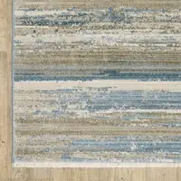 Photo of Blue And Ivory Abstract Power Loom Runner Rug With Fringe
