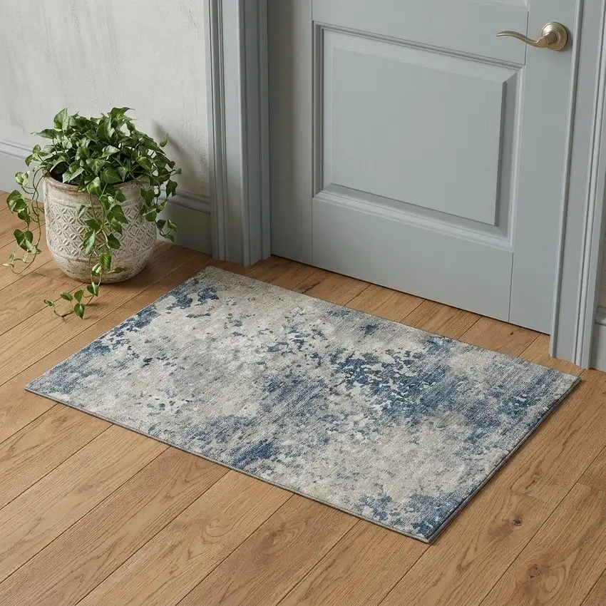 Blue And Ivory Abstract Washable Area Rug With UV Protection Photo 1