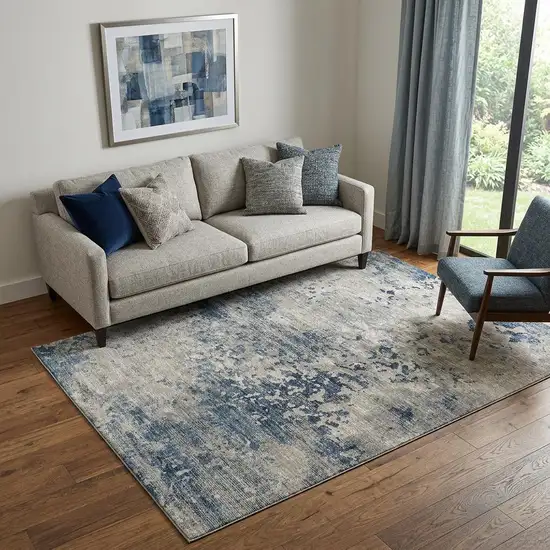 Blue And Ivory Abstract Washable Area Rug With UV Protection Photo 1