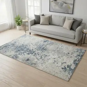 Photo of Blue And Ivory Abstract Washable Area Rug With UV Protection