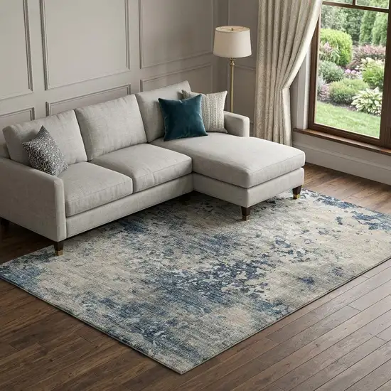 Blue And Ivory Abstract Washable Area Rug With UV Protection Photo 1