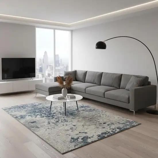 Blue And Ivory Abstract Washable Area Rug With UV Protection Photo 1