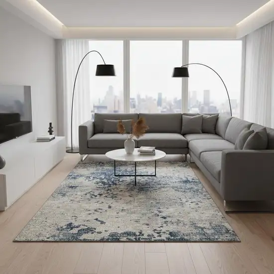 Blue And Ivory Abstract Washable Area Rug With UV Protection Photo 1