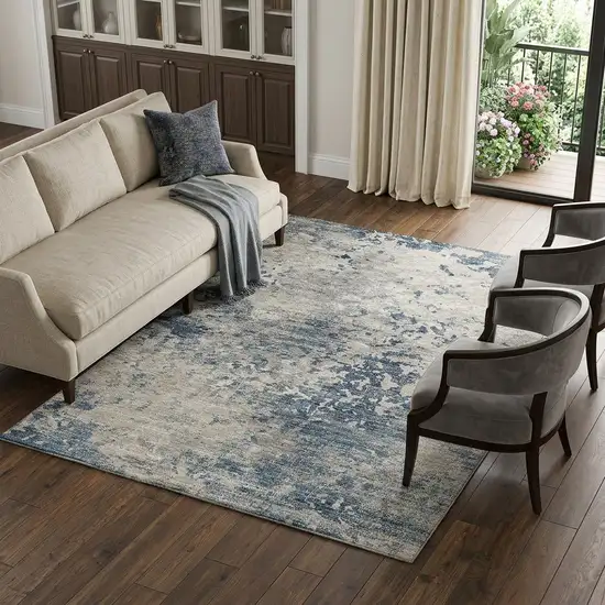 Blue And Ivory Abstract Washable Area Rug With UV Protection Photo 1