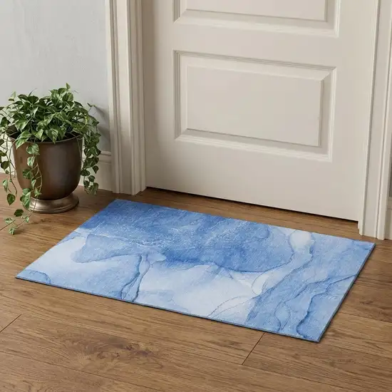 Blue And Ivory Abstract Washable Area Rug With UV Protection Photo 1