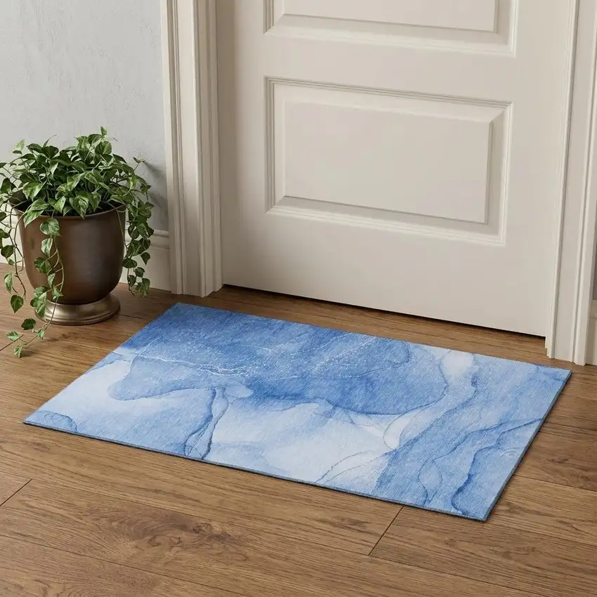 Blue And Ivory Abstract Washable Area Rug With UV Protection Photo 1