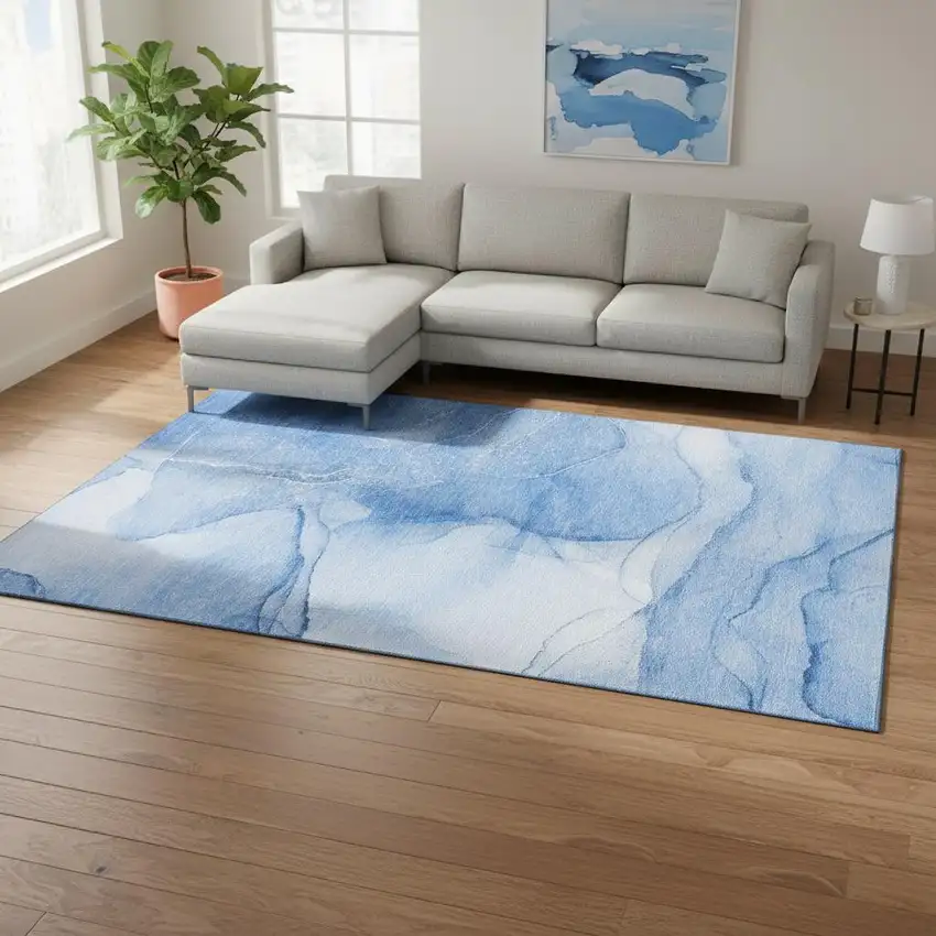 Blue And Ivory Abstract Washable Area Rug With UV Protection Photo 1