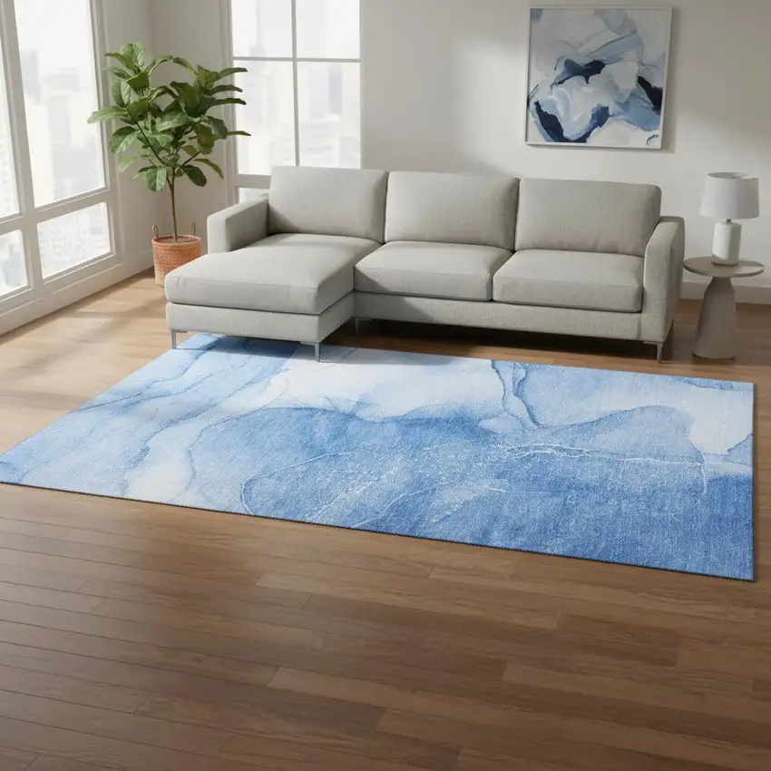 Blue And Ivory Abstract Washable Area Rug With UV Protection Photo 1