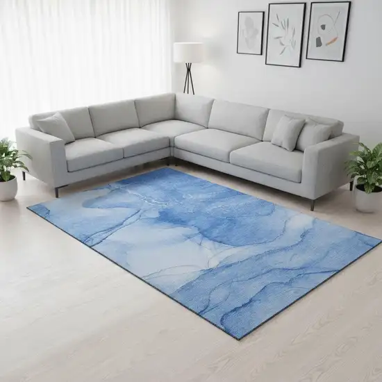 Blue And Ivory Abstract Washable Area Rug With UV Protection Photo 1