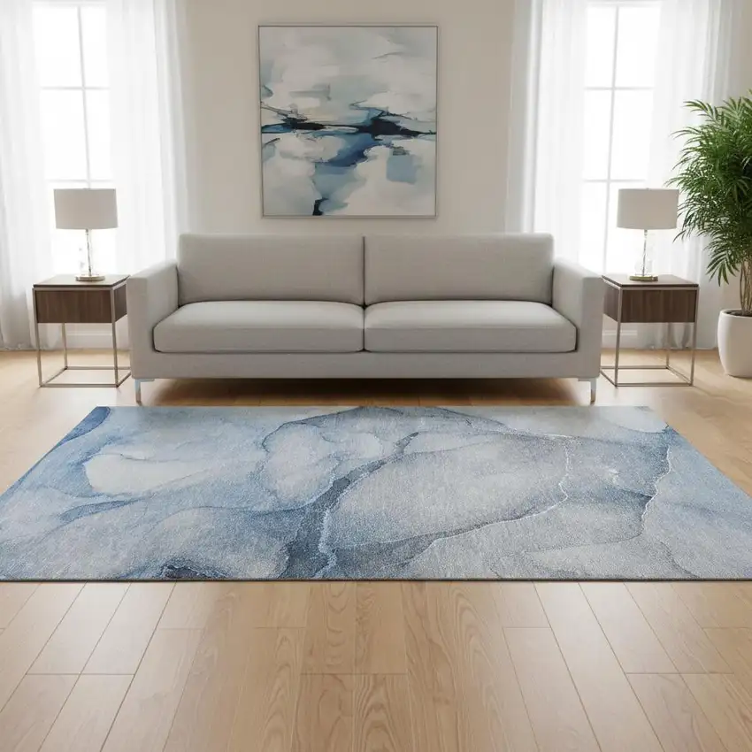 Blue And Ivory Abstract Washable Area Rug With UV Protection Photo 1