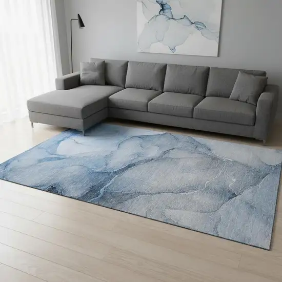 Blue And Ivory Abstract Washable Area Rug With UV Protection Photo 1