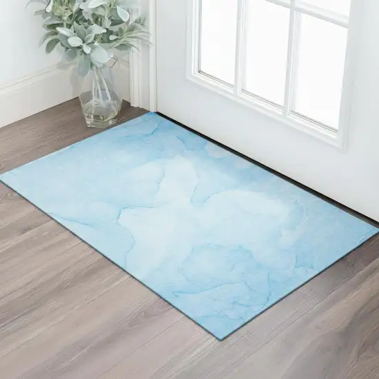 Blue And Ivory Abstract Washable Area Rug With UV Protection Photo 1