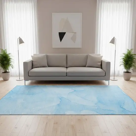 Blue And Ivory Abstract Washable Area Rug With UV Protection Photo 1