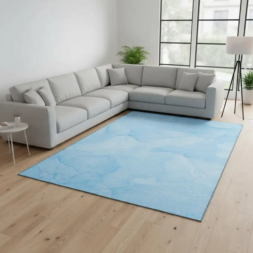 Blue And Ivory Abstract Washable Area Rug With UV Protection Photo 1