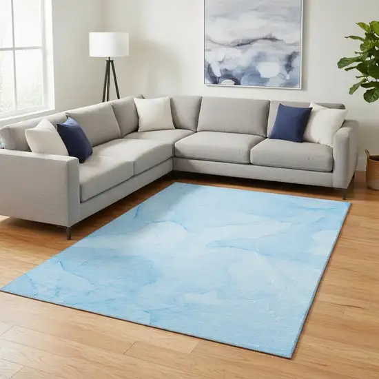 Blue And Ivory Abstract Washable Area Rug With UV Protection Photo 1