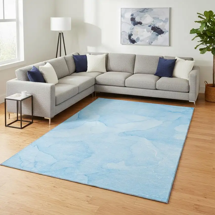 Blue And Ivory Abstract Washable Area Rug With UV Protection Photo 1