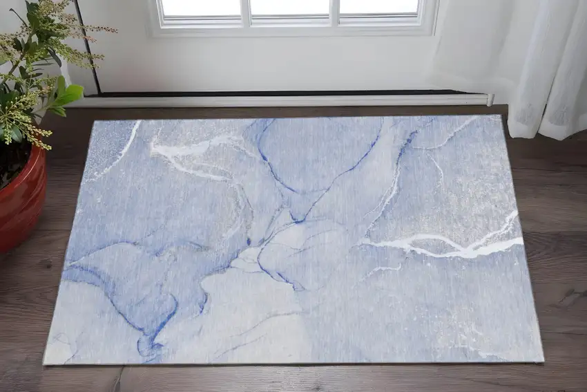 Blue And Ivory Abstract Washable Area Rug With UV Protection Photo 2
