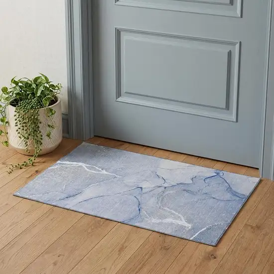 Blue And Ivory Abstract Washable Area Rug With UV Protection Photo 1
