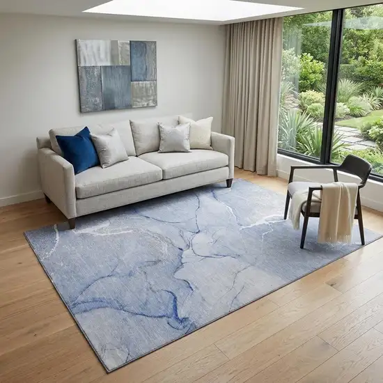 Blue And Ivory Abstract Washable Area Rug With UV Protection Photo 1