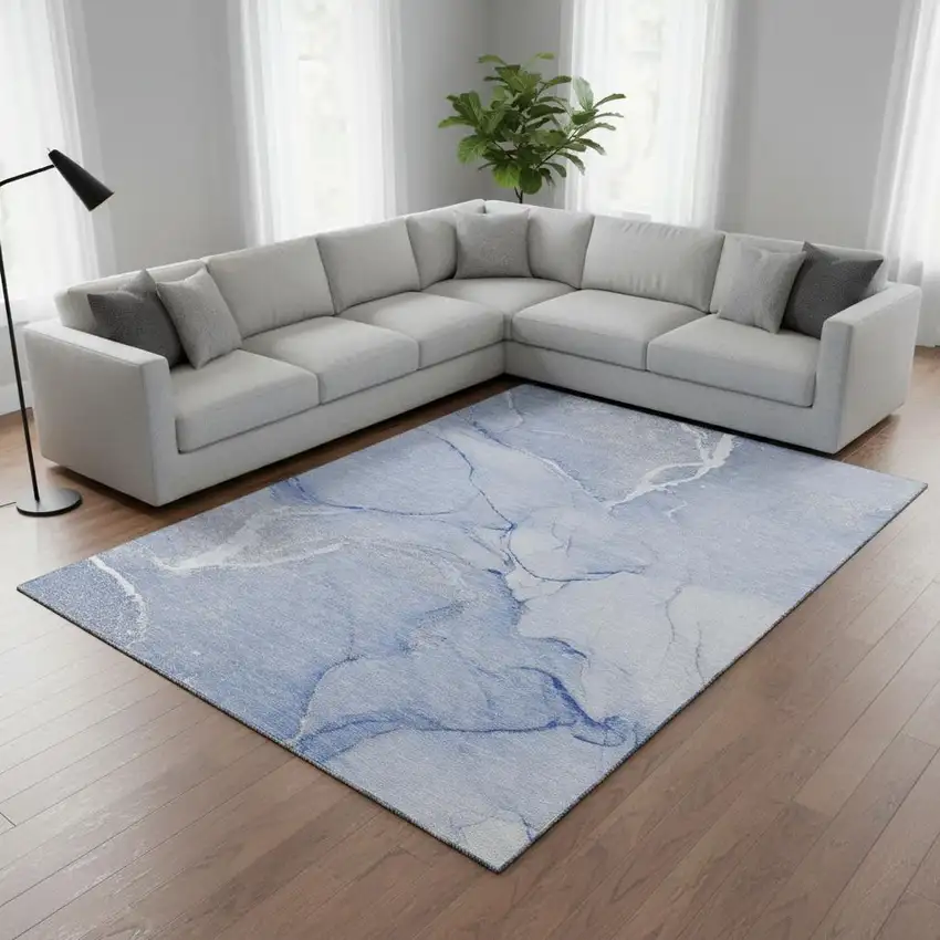 Blue And Ivory Abstract Washable Area Rug With UV Protection Photo 1