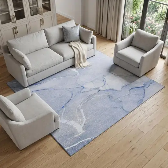 Blue And Ivory Abstract Washable Area Rug With UV Protection Photo 1