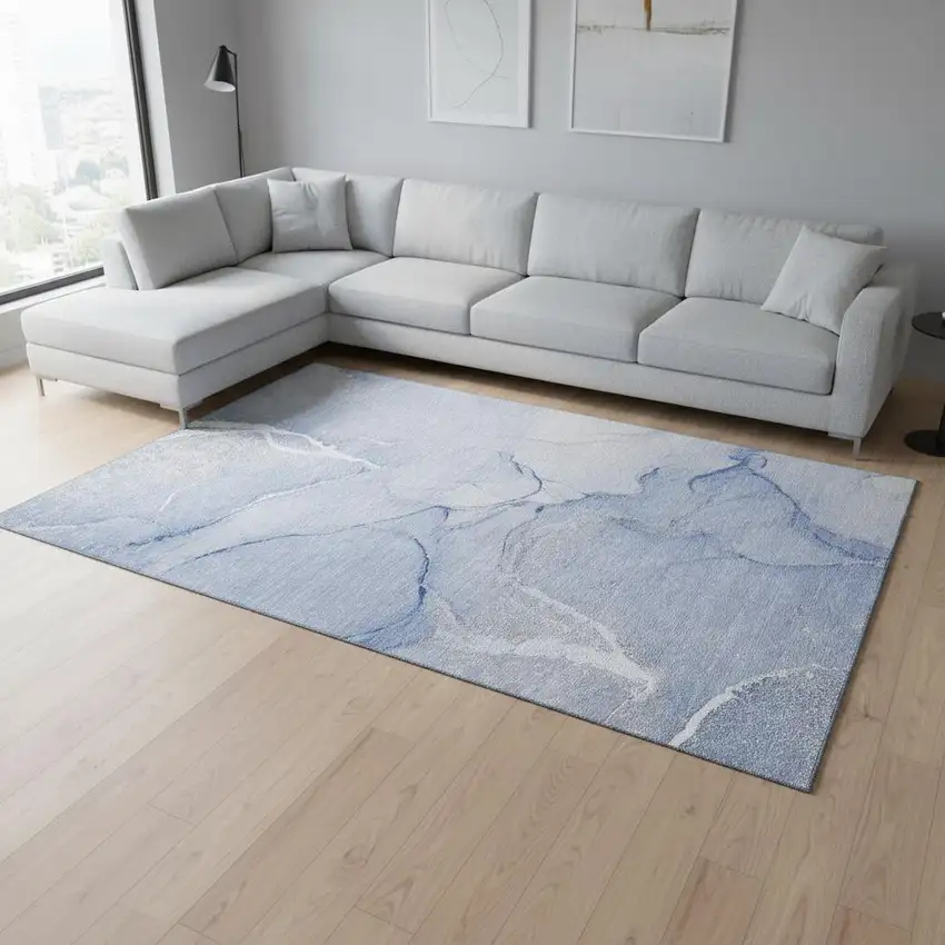Blue And Ivory Abstract Washable Area Rug With UV Protection Photo 1