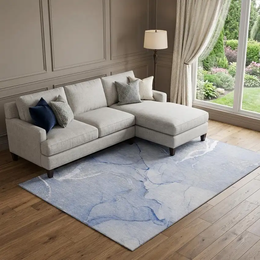 Blue And Ivory Abstract Washable Area Rug With UV Protection Photo 1