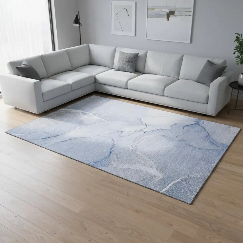 Blue And Ivory Abstract Washable Area Rug With UV Protection Photo 1