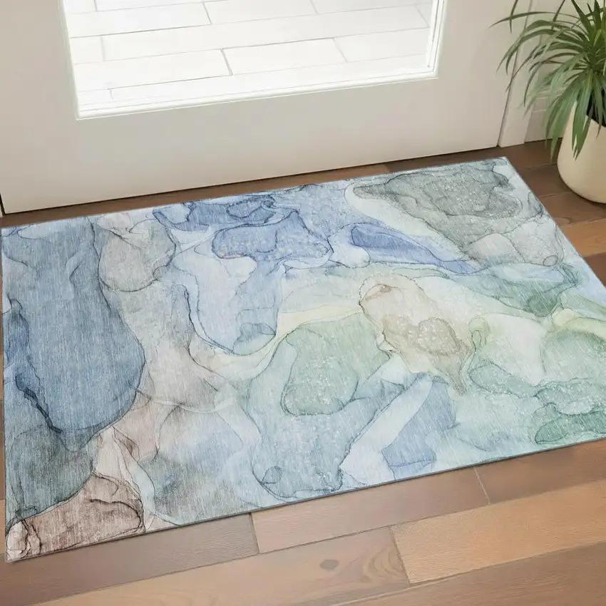Blue And Ivory Abstract Washable Area Rug With UV Protection Photo 1