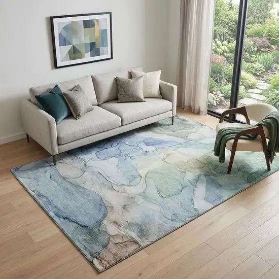 Blue And Ivory Abstract Washable Area Rug With UV Protection Photo 1