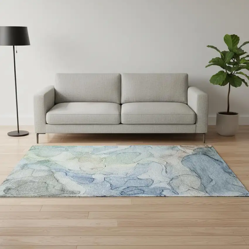 Blue And Ivory Abstract Washable Area Rug With UV Protection Photo 1