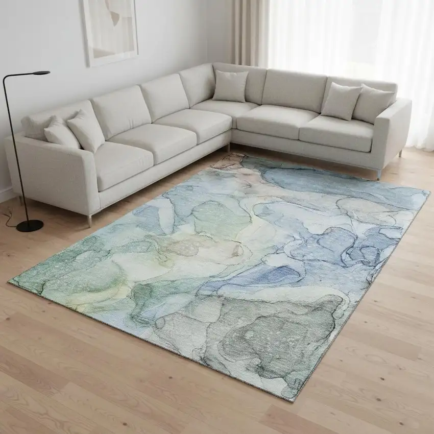 Blue And Ivory Abstract Washable Area Rug With UV Protection Photo 1