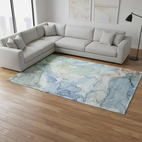 Blue And Ivory Abstract Washable Area Rug With UV Protection Photo 1