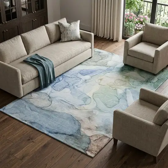 Blue And Ivory Abstract Washable Area Rug With UV Protection Photo 1