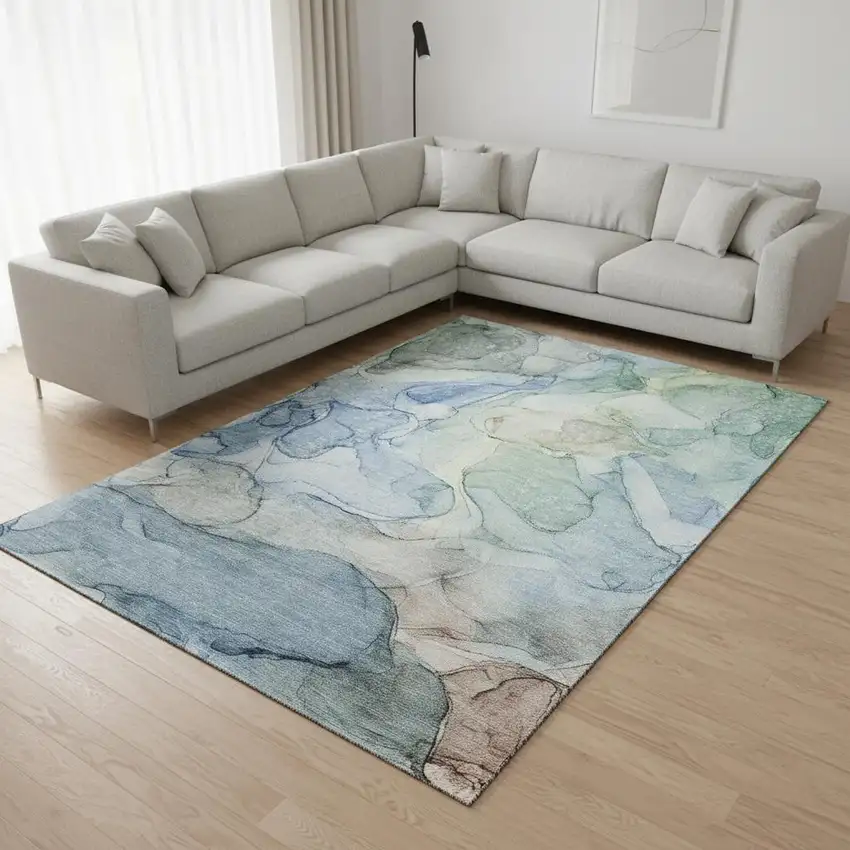 Blue And Ivory Abstract Washable Area Rug With UV Protection Photo 1