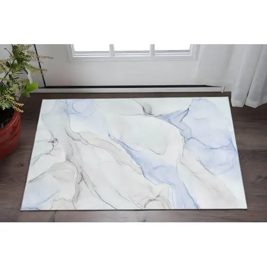 Blue And Ivory Abstract Washable Area Rug With UV Protection Photo 2