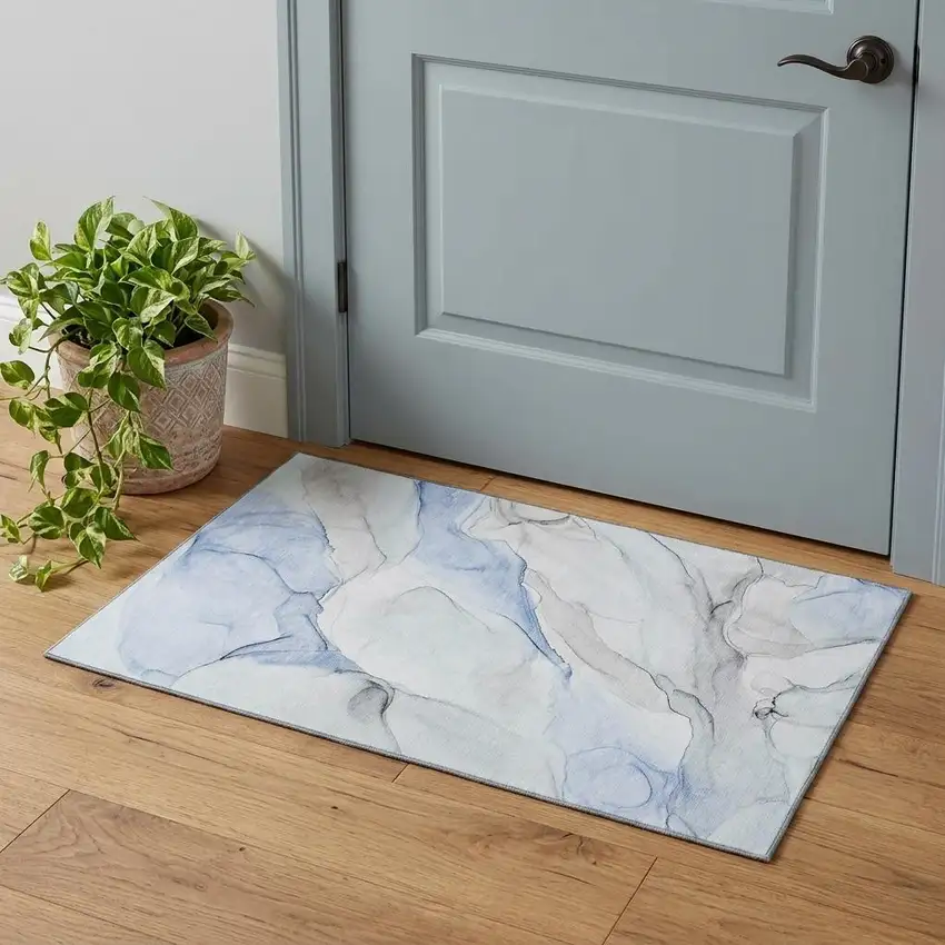 Blue And Ivory Abstract Washable Area Rug With UV Protection Photo 1