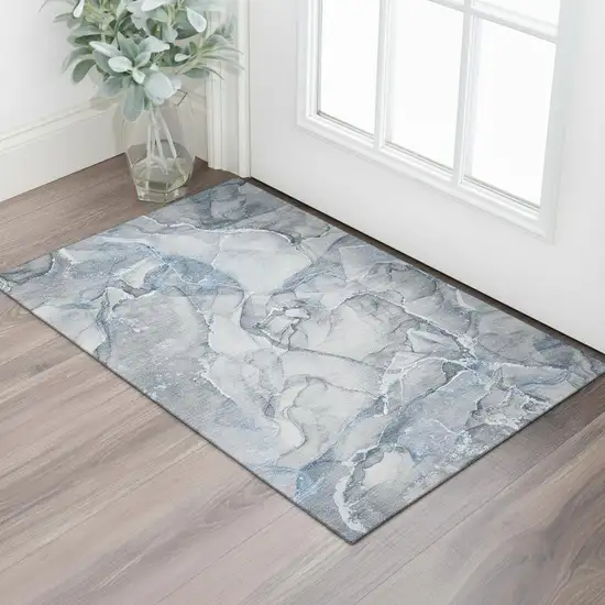 Blue And Ivory Abstract Washable Area Rug With UV Protection Photo 1